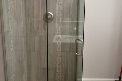 Opening up a small bathroom space with frameless shower enclosures