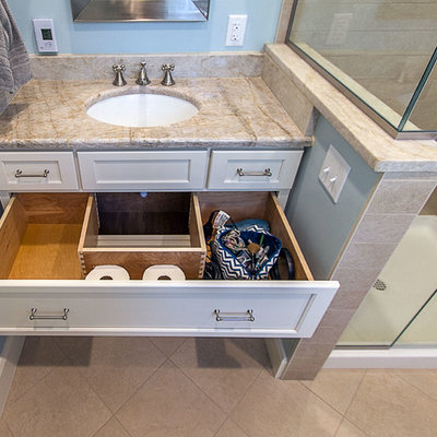 Corner shower - small traditional master beige tile ceramic tile corner shower idea in Other with an undermount sink, recessed-panel cabinets, white cabinets, a two-piece toilet and blue walls