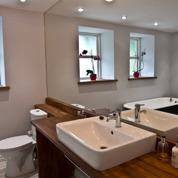 Original kitchens of the 2 lower flats transformed to create family bathroom