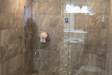 Double shower - large coastal master beige tile and porcelain tile double shower idea in Toronto