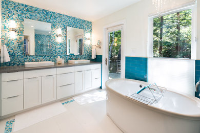 Freestanding bathtub - modern master blue tile and mosaic tile ceramic tile and white floor freestanding bathtub idea in San Francisco with shaker cabinets, white cabinets, white walls, a vessel sink, quartz countertops and gray countertops
