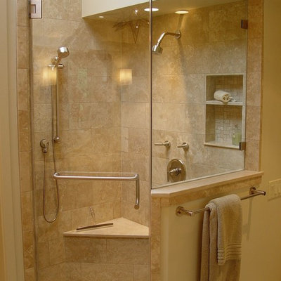 Example of a trendy travertine tile corner shower design in San Francisco