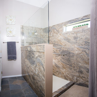 Mid-sized traditional 3/4 bathroom in Phoenix with raised-panel cabinets, white cabinets, an open shower, a one-piece toilet, beige tile, brown tile, gray tile, stone slab, purple walls, slate floors, an undermount sink and solid surface benchtops.