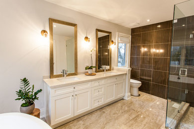 Example of a mid-sized minimalist master brown tile and ceramic tile bathroom design in Toronto with shaker cabinets, white cabinets, white walls, an undermount sink and quartzite countertops