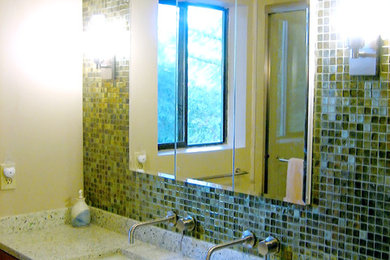 Inspiration for a modern green tile and glass tile bathroom remodel in San Francisco with flat-panel cabinets, medium tone wood cabinets and quartz countertops