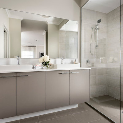 Inspiration for a contemporary beige tile and gray tile bathroom remodel in Perth with flat-panel cabinets, gray cabinets, white walls and a vessel sink