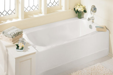 Example of a large classic master mosaic tile floor and white floor corner bathtub design in Boston with beige walls