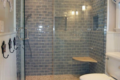 Inspiration for a mid-sized coastal 3/4 blue tile and porcelain tile pebble tile floor alcove shower remodel in Newark with beige walls and a wall-mount sink