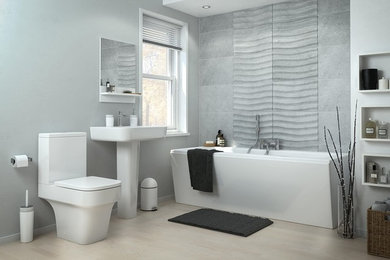 Diseño de cuarto de baño único minimalista de tamaño medio con bañera exenta, sanitario de una pieza, paredes grises, suelo de madera clara, aseo y ducha, lavabo con pedestal y suelo beige