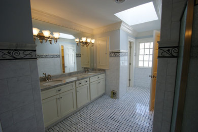 Inspiration for a large timeless master multicolored tile and ceramic tile ceramic tile, multicolored floor and double-sink bathroom remodel in Indianapolis with recessed-panel cabinets, white cabinets, multicolored walls, a drop-in sink, marble countertops, multicolored countertops and a built-in vanity