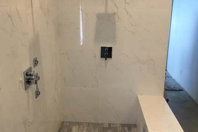 Example of a large minimalist 3/4 white tile and marble tile wet room design in Miami
