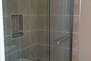 Design ideas for a medium sized bathroom in Calgary with a corner shower and ceramic flooring.