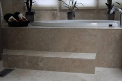 Drop-in bathtub - mid-sized master beige tile drop-in bathtub idea in Portland