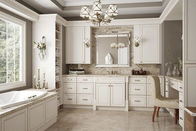 Idéer för att renovera ett stort vintage en-suite badrum, med luckor med upphöjd panel, vita skåp, ett platsbyggt badkar, beige kakel, stenhäll, grå väggar, klinkergolv i keramik, ett undermonterad handfat och granitbänkskiva
