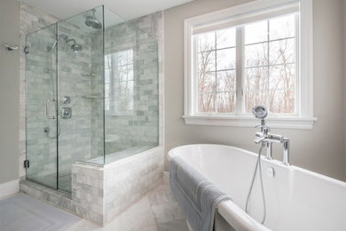 Bathroom - large traditional master gray tile and glass tile porcelain tile bathroom idea in New York with gray walls