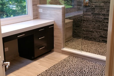 Large minimalist master beige tile and porcelain tile porcelain tile and beige floor doorless shower photo in Chicago with flat-panel cabinets, black cabinets, a two-piece toilet, beige walls, an undermount sink, quartz countertops and a hinged shower door