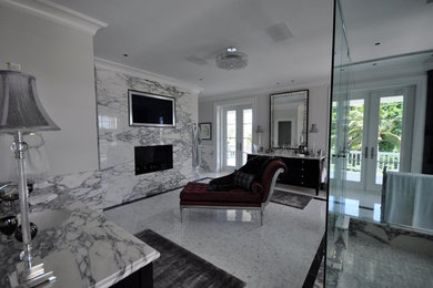 Example of a large trendy master marble tile marble floor and white floor corner shower design in Miami with gray walls, an undermount sink, marble countertops, furniture-like cabinets, black cabinets and a hinged shower door