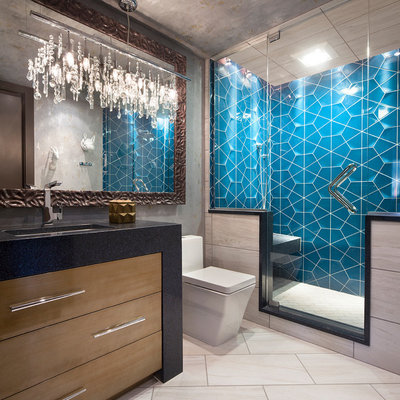 Alcove shower - contemporary 3/4 blue tile beige floor alcove shower idea in Other with flat-panel cabinets, medium tone wood cabinets, gray walls and black countertops