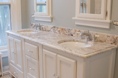 Example of a mid-sized classic master white tile and stone tile mosaic tile floor and multicolored floor bathroom design in Chicago with recessed-panel cabinets, white cabinets, gray walls, granite countertops and an undermount sink