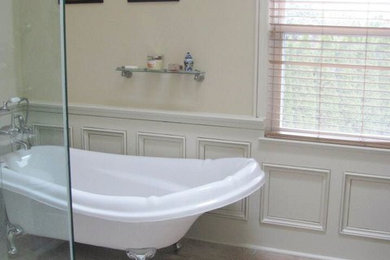 Example of a mid-sized classic master ceramic tile and brown floor claw-foot bathtub design in New York