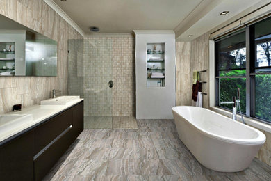 Bathroom - contemporary master porcelain tile porcelain tile and brown floor bathroom idea in New York with flat-panel cabinets, dark wood cabinets, brown walls and a drop-in sink
