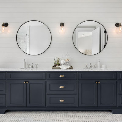 Inspiration for a large transitional master gray floor bathroom remodel in Houston with marble countertops, shaker cabinets, blue cabinets, white walls, an undermount sink and white countertops