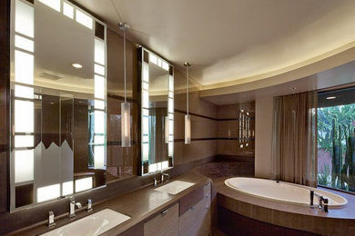 Inspiration for a contemporary master drop-in bathtub remodel in Phoenix with flat-panel cabinets, medium tone wood cabinets and wood countertops