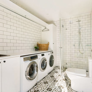 Transitional bathroom in Sydney with flat-panel cabinets, white cabinets, multi-coloured floor, a corner shower, a two-piece toilet, white tile, subway tile, a drop-in sink, a hinged shower door, white benchtops, a single vanity and a built-in vanity.