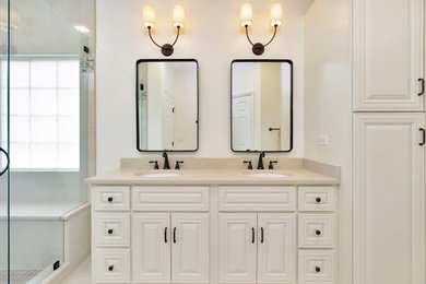 Inspiration for a mid-sized modern master white tile and porcelain tile porcelain tile, beige floor and double-sink bathroom remodel in Charlotte with raised-panel cabinets, white cabinets, white walls, quartz countertops, beige countertops and a built-in vanity