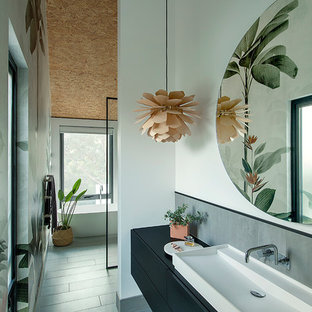 Design ideas for a mid-sized contemporary master bathroom in Perth with furniture-like cabinets, black cabinets, a freestanding tub, an open shower, gray tile, ceramic tile, white walls, ceramic floors, a vessel sink, laminate benchtops, grey floor, an open shower and black benchtops.