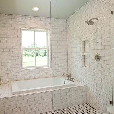 Bathroom - mid-sized cottage master white tile and subway tile ceramic tile and black floor bathroom idea in Oklahoma City with white walls and a wall-mount sink