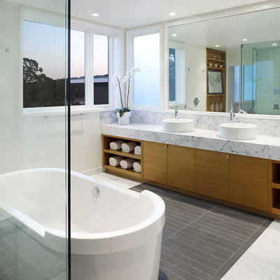 Example of a trendy bathroom design in San Francisco with marble countertops and a vessel sink