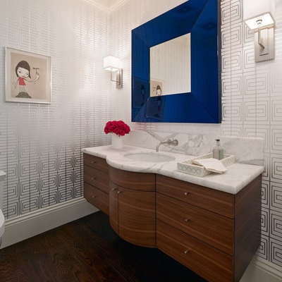 Trendy bathroom photo in San Francisco with an undermount sink, flat-panel cabinets and dark wood cabinets