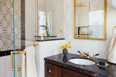 Inspiration for a mid-sized timeless master beige tile and marble tile walk-in shower remodel in San Francisco with furniture-like cabinets, dark wood cabinets, a one-piece toilet, beige walls, a drop-in sink, marble countertops and a hinged shower door