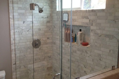 Inspiration for a mid-sized transitional brown tile and mosaic tile corner shower remodel in Los Angeles with quartz countertops