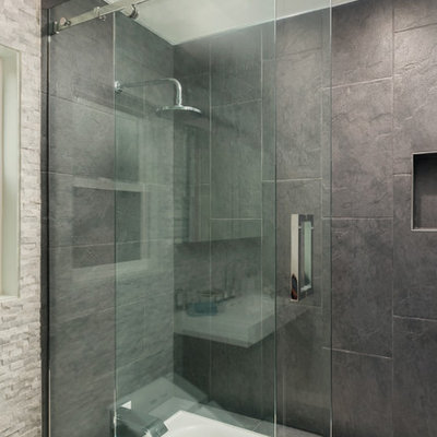 Small minimalist master black tile and cement tile ceramic tile bathroom photo in San Francisco with an integrated sink, flat-panel cabinets, dark wood cabinets, quartz countertops, a wall-mount toilet and gray walls