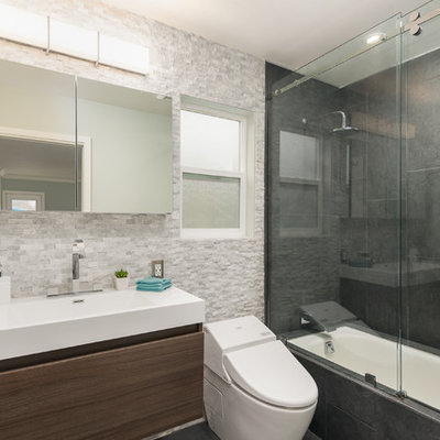 Small minimalist master black tile and cement tile ceramic tile bathroom photo in San Francisco with an integrated sink, flat-panel cabinets, dark wood cabinets, quartz countertops, a wall-mount toilet and gray walls