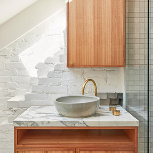 Design ideas for a contemporary bathroom in Sydney with shaker cabinets, medium wood cabinets, white tile, mosaic tile, white walls, mosaic tile floors, a vessel sink and white benchtops.