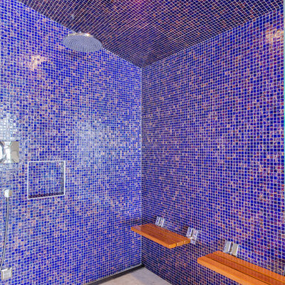 Bathroom - huge contemporary blue tile, multicolored tile and glass tile light wood floor bathroom idea in Other with flat-panel cabinets, brown cabinets, a wall-mount toilet, gray walls, an undermount sink and granite countertops