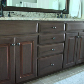 Painted and glazed melamine master bathroom vanity with copper accents