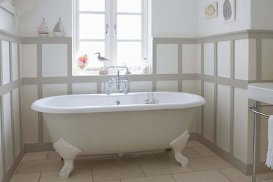 Example of a mid-sized cottage chic master ceramic tile and beige floor bathroom design in Chicago with a one-piece toilet, white walls and a trough sink