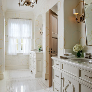 Tuscan master bathroom photo in Miami with an undermount sink, recessed-panel cabinets, beige cabinets and multicolored walls