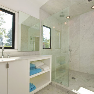 Inspiration for a modern white tile bathroom remodel in San Francisco with an integrated sink, flat-panel cabinets and white cabinets