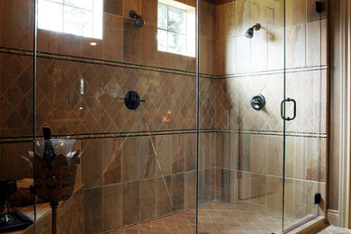 Mid-sized mountain style master beige tile and stone tile limestone floor corner shower photo in Austin with brown walls