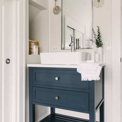 Example of a mid-sized transitional 3/4 white tile and subway tile cement tile floor and blue floor bathroom design in Chicago with blue cabinets, white walls, a vessel sink, furniture-like cabinets, white countertops and solid surface countertops