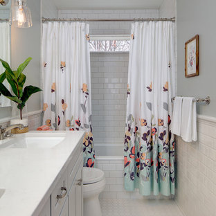 Example of a transitional white tile and subway tile mosaic tile floor bathroom design in Baltimore with recessed-panel cabinets, gray walls and an undermount sink
