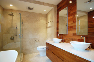 Bathroom - mid-sized contemporary master beige tile and ceramic tile ceramic tile bathroom idea in New York with a vessel sink, flat-panel cabinets, a one-piece toilet, beige walls and medium tone wood cabinets