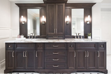 Mid-sized elegant master mosaic tile floor bathroom photo in New York with beaded inset cabinets, brown cabinets, gray walls, a drop-in sink and quartzite countertops