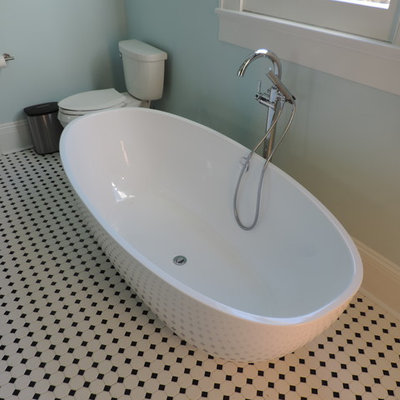 Mid-sized elegant master mosaic tile floor and multicolored floor bathroom photo in New Orleans with shaker cabinets, gray cabinets, a one-piece toilet, blue walls, an undermount sink and marble countertops