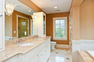 Example of a large transitional master bathroom design in Boston with granite countertops